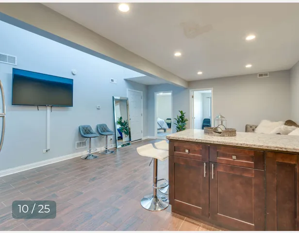a kitchen with lots of counter space sink and cabinets