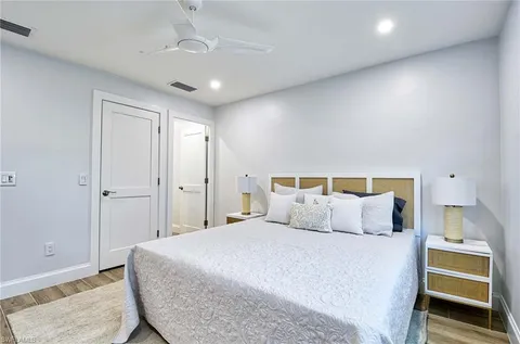a bedroom with a bed and a lamp