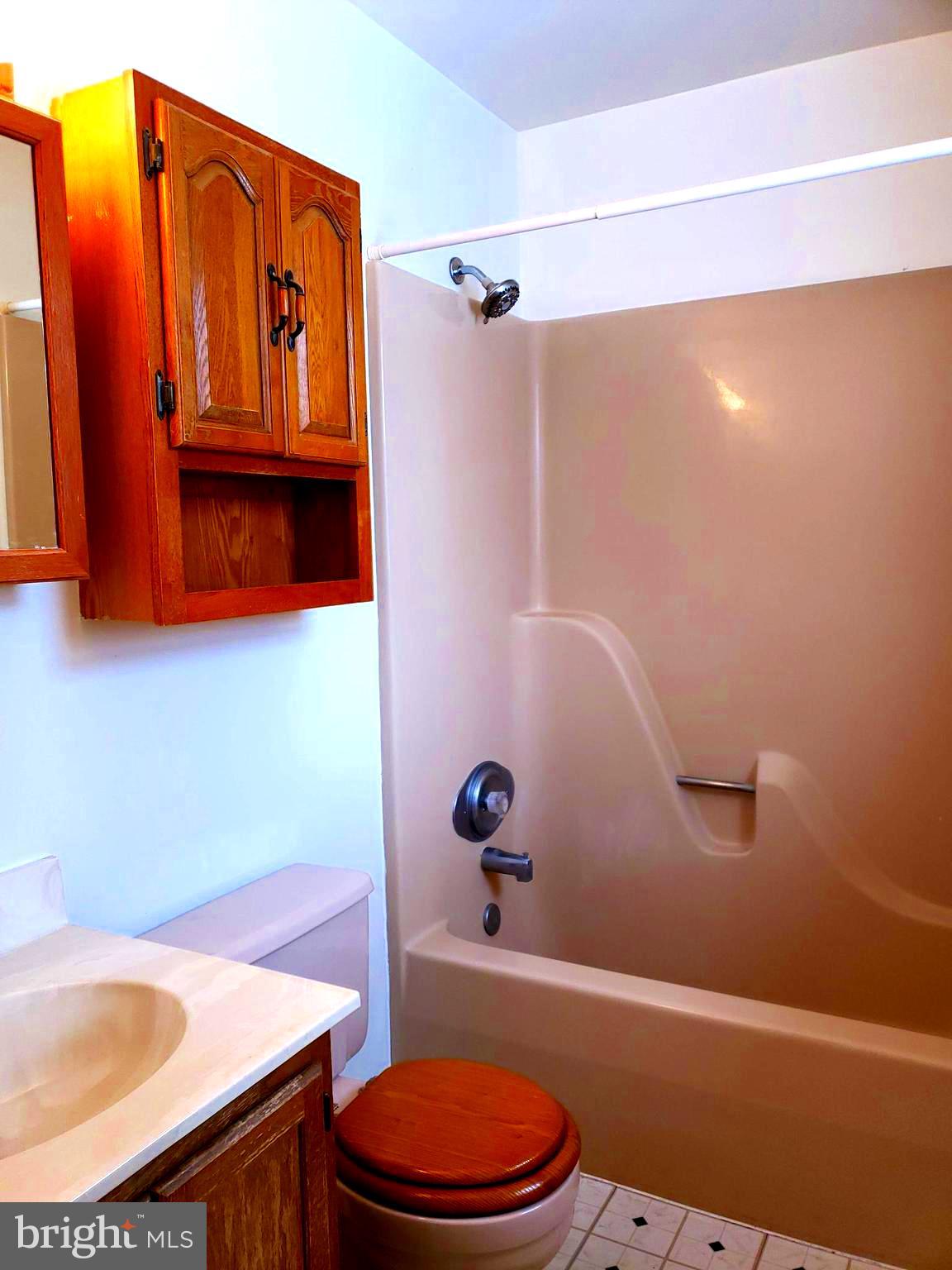 2022 Suffolk Road Finksburg, MD 21048 - Photo 12 of 19 a bathroom with a sink a toilet and shower