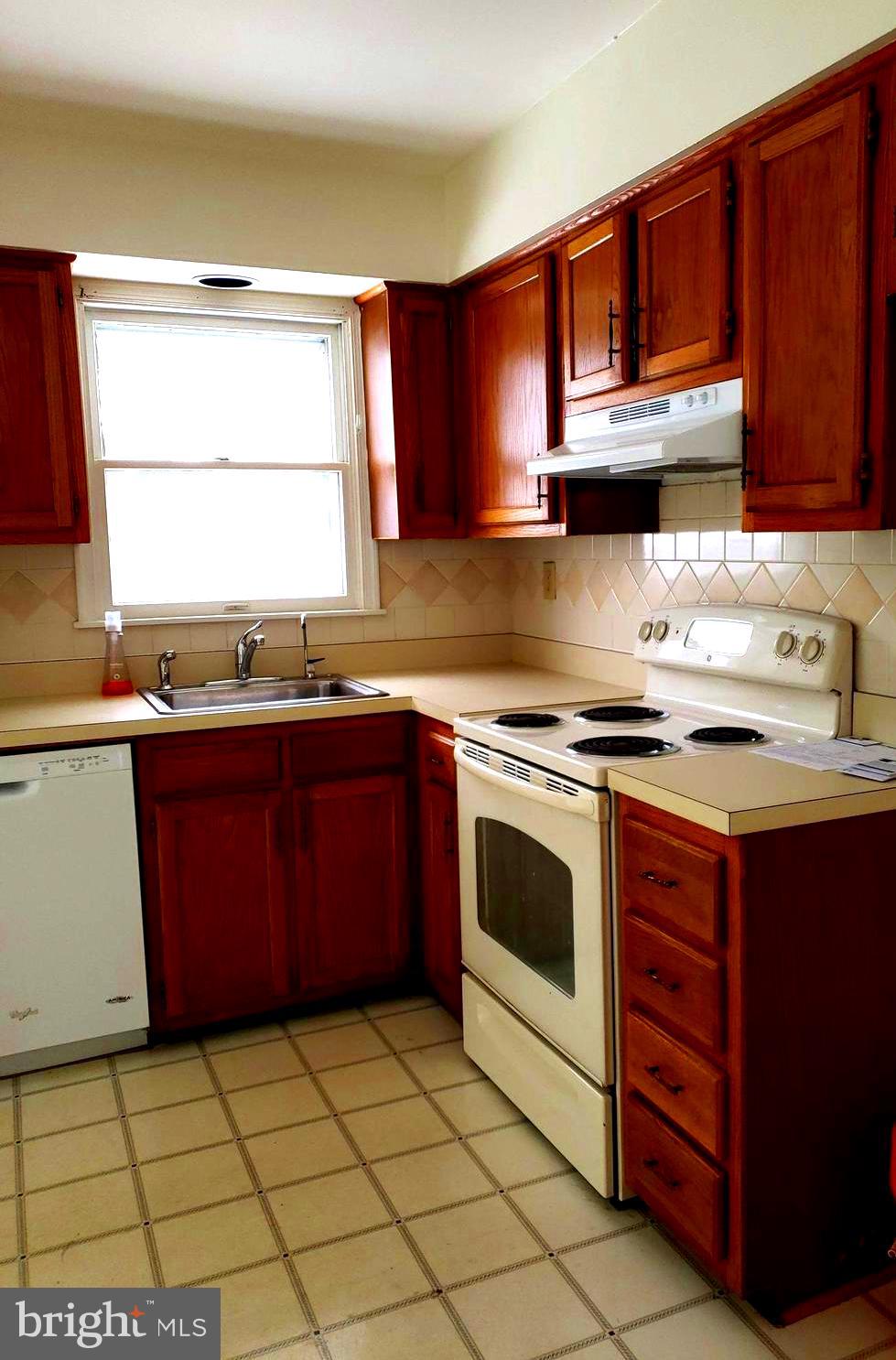 2022 Suffolk Road Finksburg, MD 21048 - Photo 9 of 19 a kitchen with stainless steel appliances granite countertop a stove a sink and a microwave
