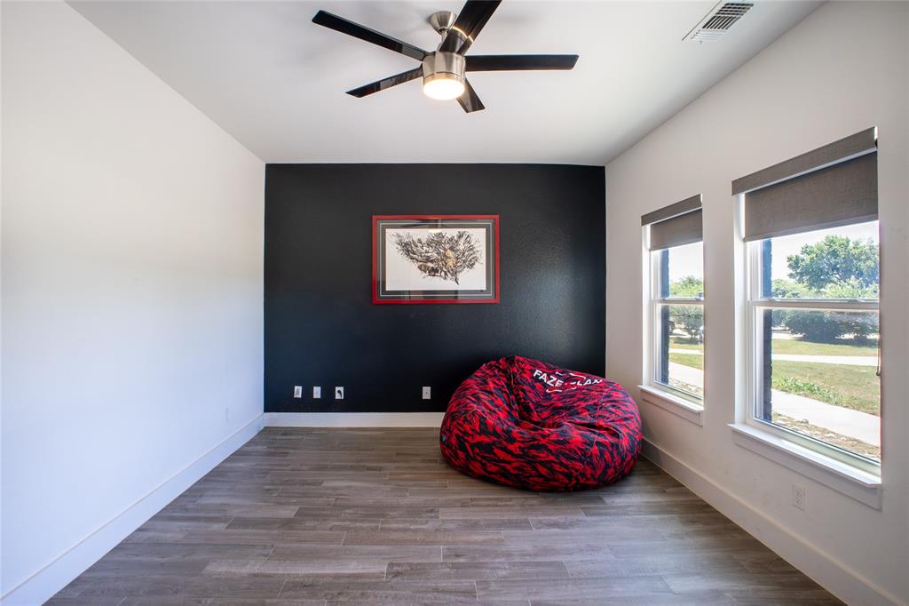 311 Dobbs Trail Springtown, TX 76082 - Photo 18 of 33 a bedroom with a bed and window