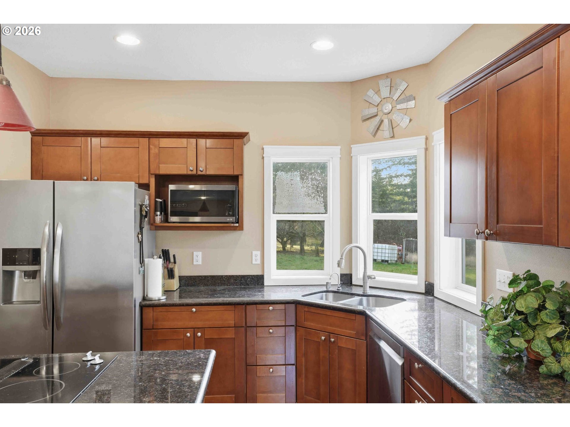 4204 Northeast Cardiel Road Washougal, WA 98671 - Photo 12 of 42 a kitchen with stainless steel appliances a sink and a refrigerator