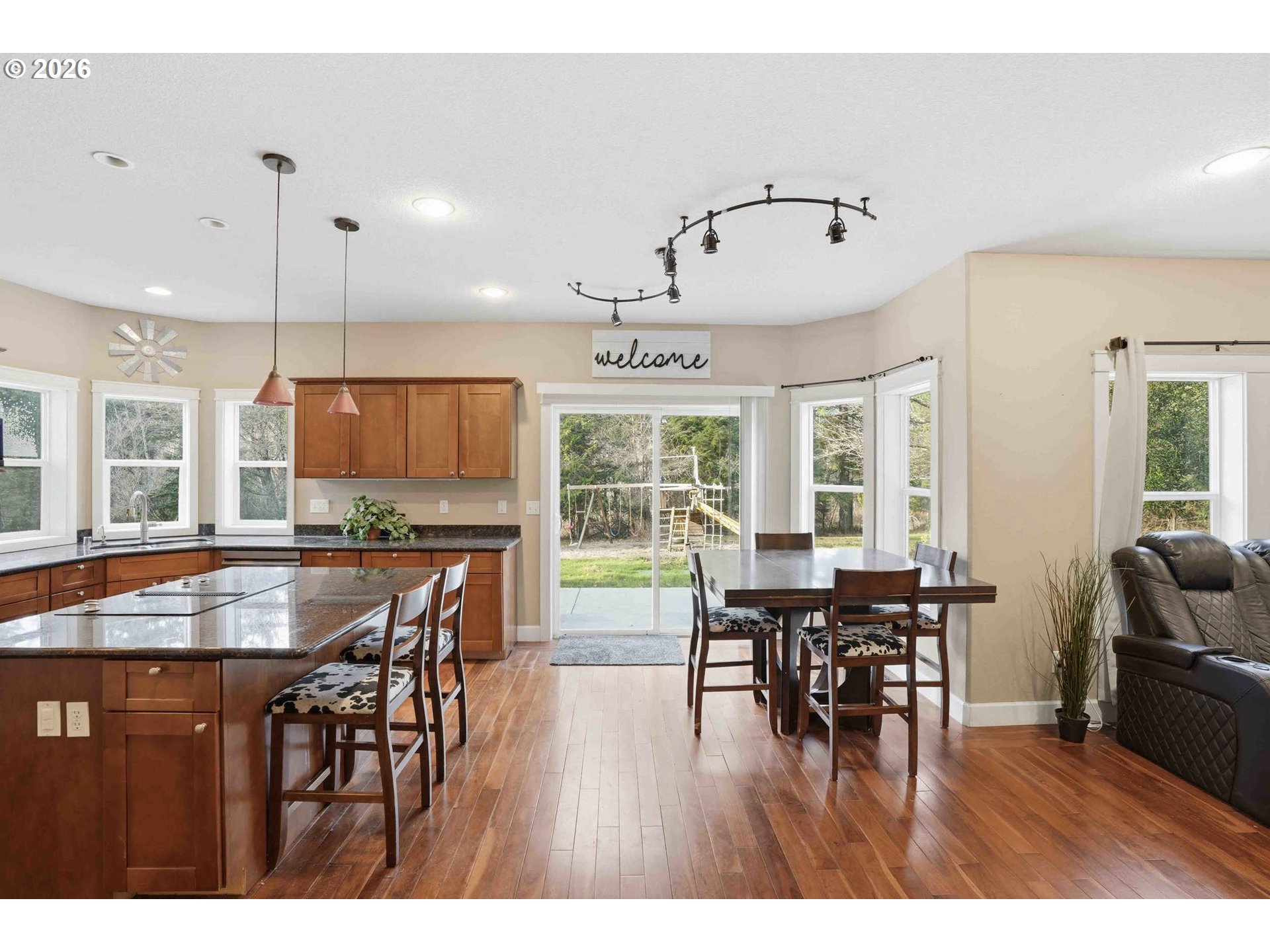 4204 Northeast Cardiel Road Washougal, WA 98671 - Photo 14 of 42 a dining room with furniture window and wooden floor