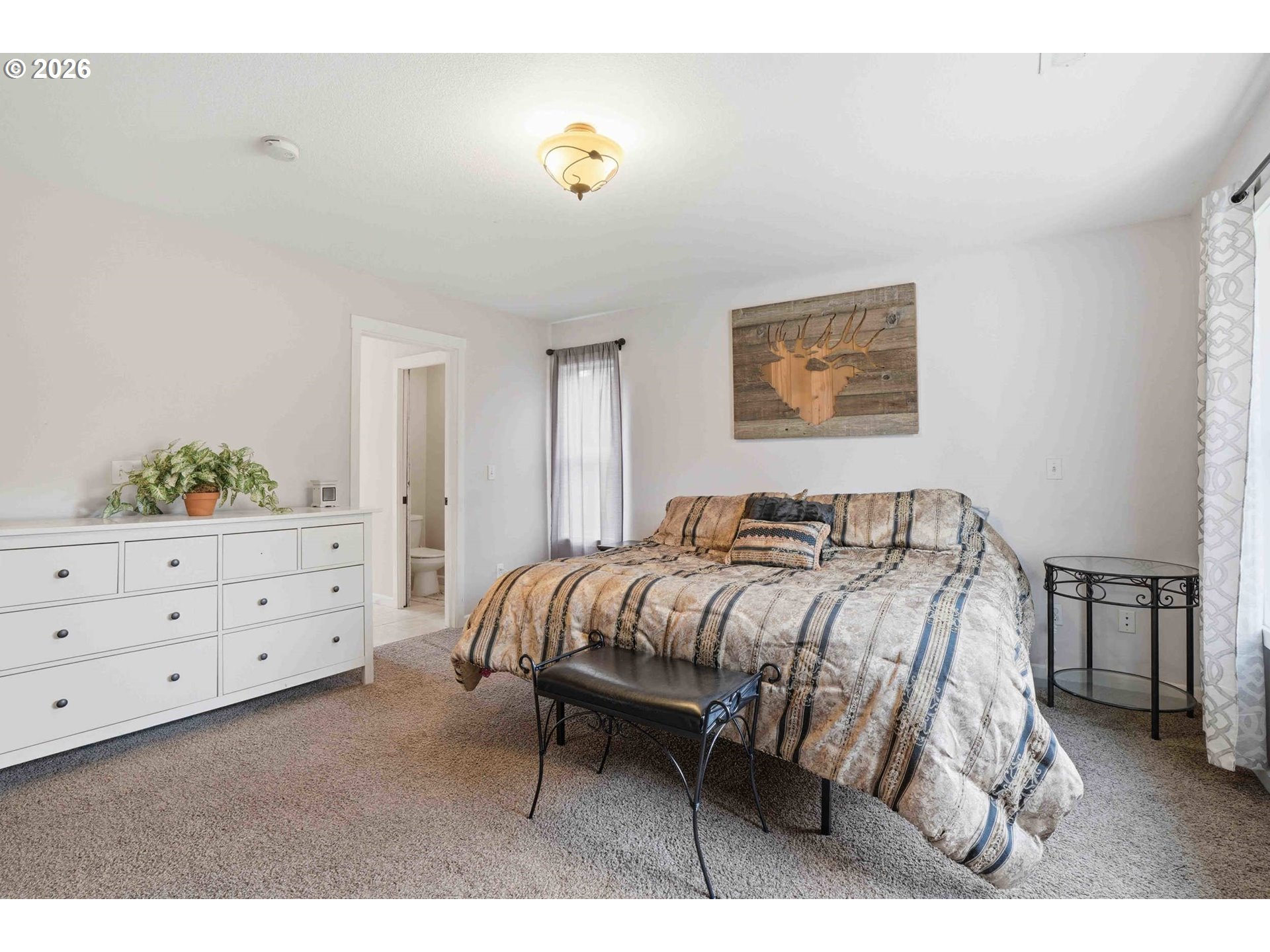 4204 Northeast Cardiel Road Washougal, WA 98671 - Photo 23 of 42 a bed room with a bed and a night stand