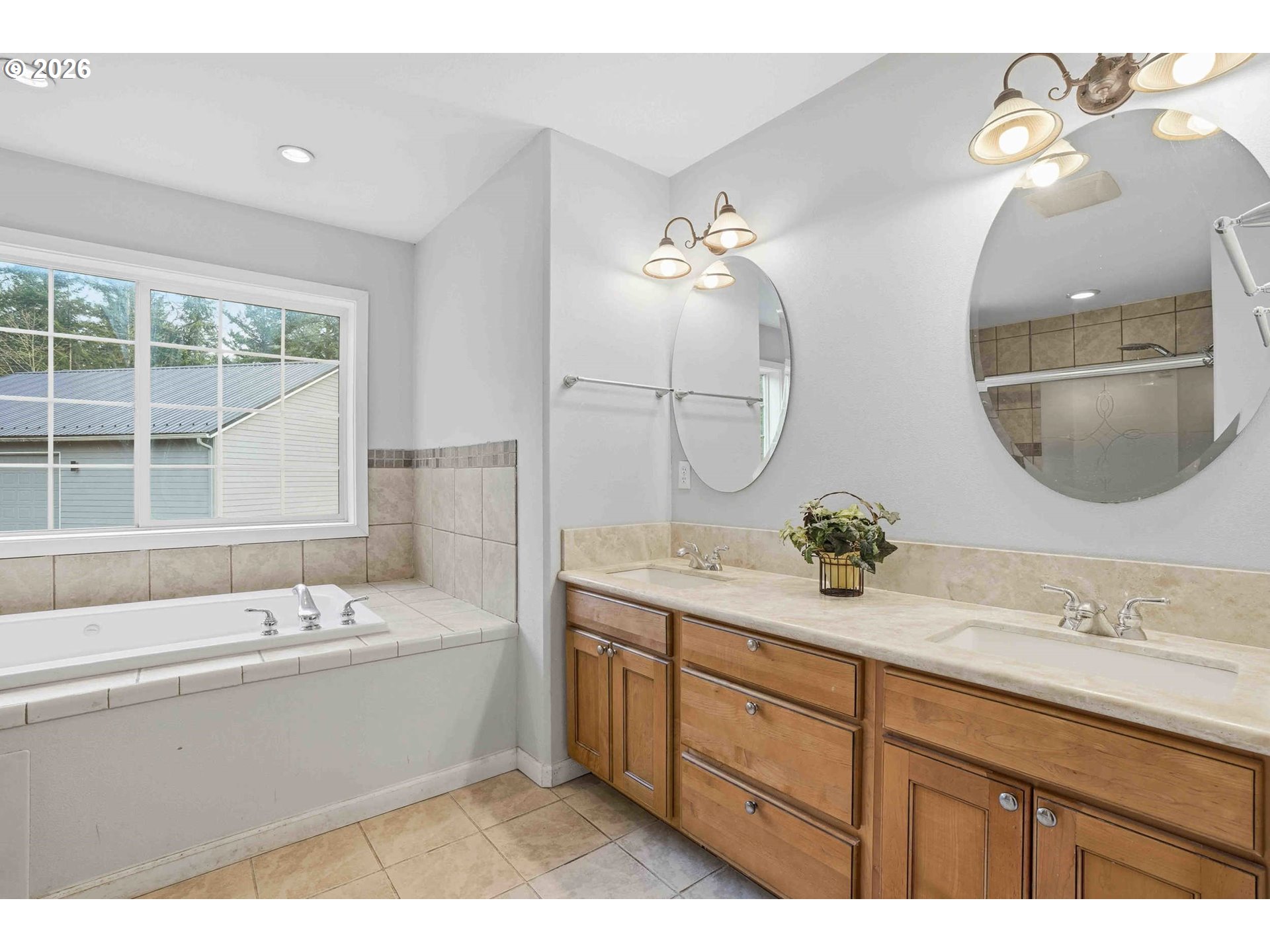 4204 Northeast Cardiel Road Washougal, WA 98671 - Photo 25 of 42 a bathroom with a double vanity sink and a mirror