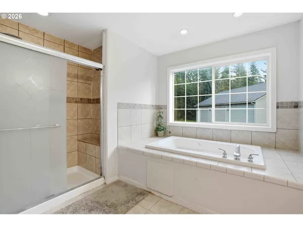 a bathroom with a bathtub and a sink
