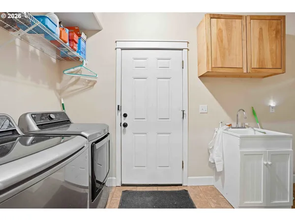 a view of storage and utility room with a sink