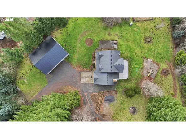 an aerial view of a house with a yard