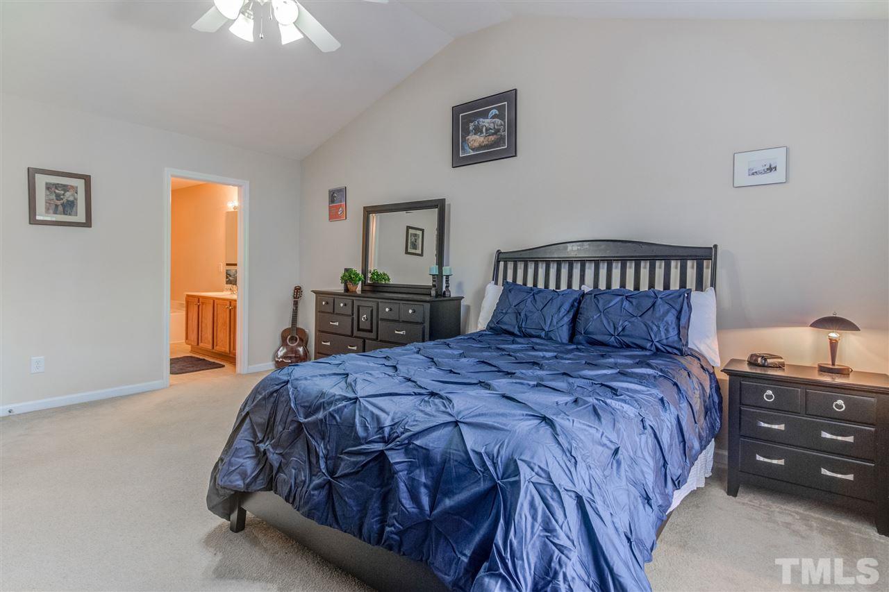 4706 Altha Street Raleigh, NC 27606 - Photo 8 of 14 Spacious master bedroom with vaulted ceiling, ceiling fan and two closets!
