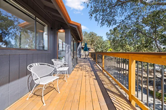 a view of balcony with furniture