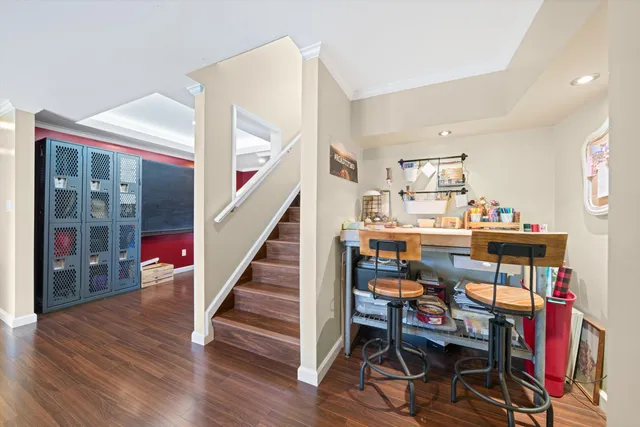 a dining room with furniture and wooden floor