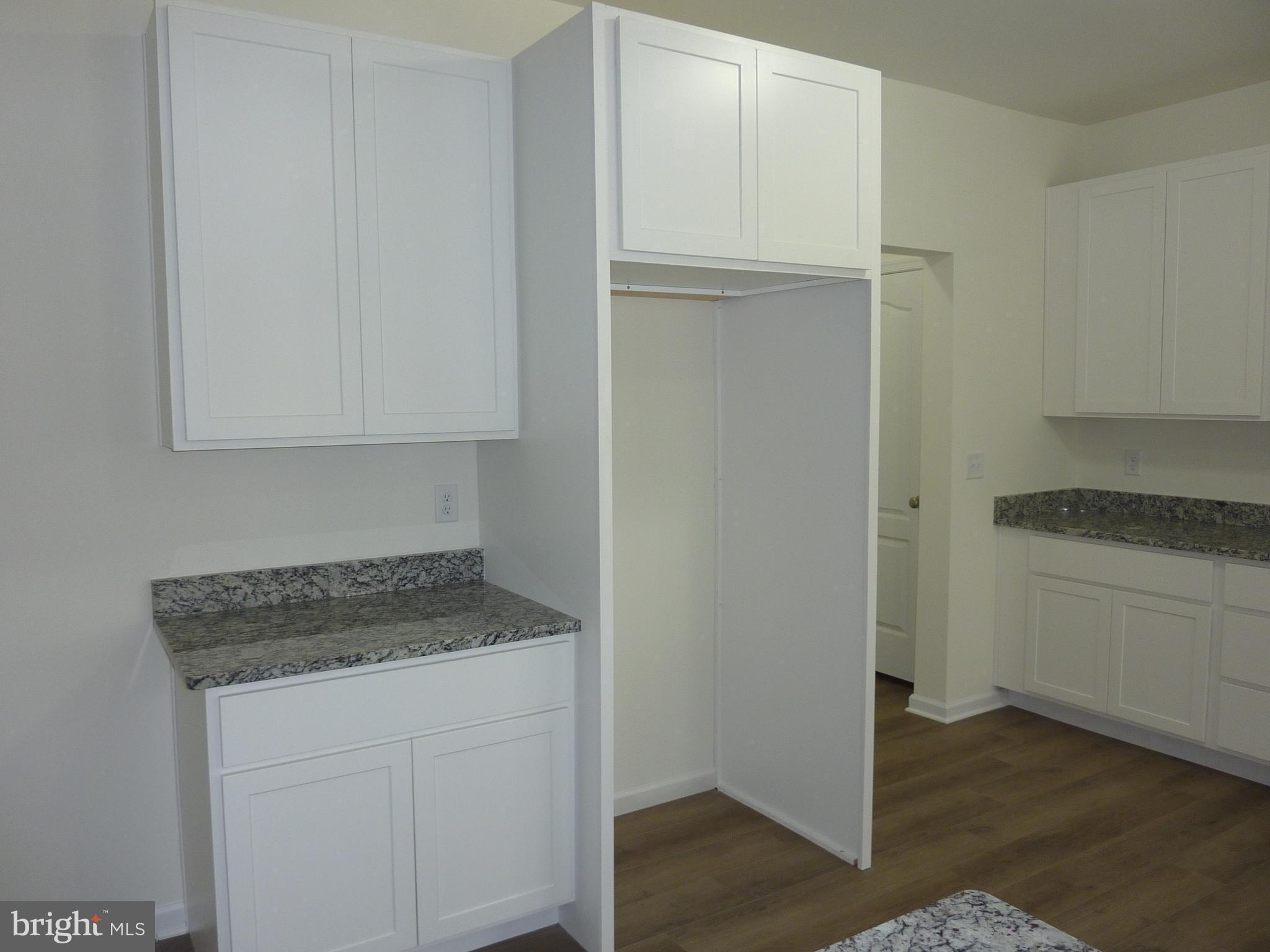 175 Villa Drive Clayton, DE 19938 - Photo 13 of 44 a kitchen with a sink and cabinets