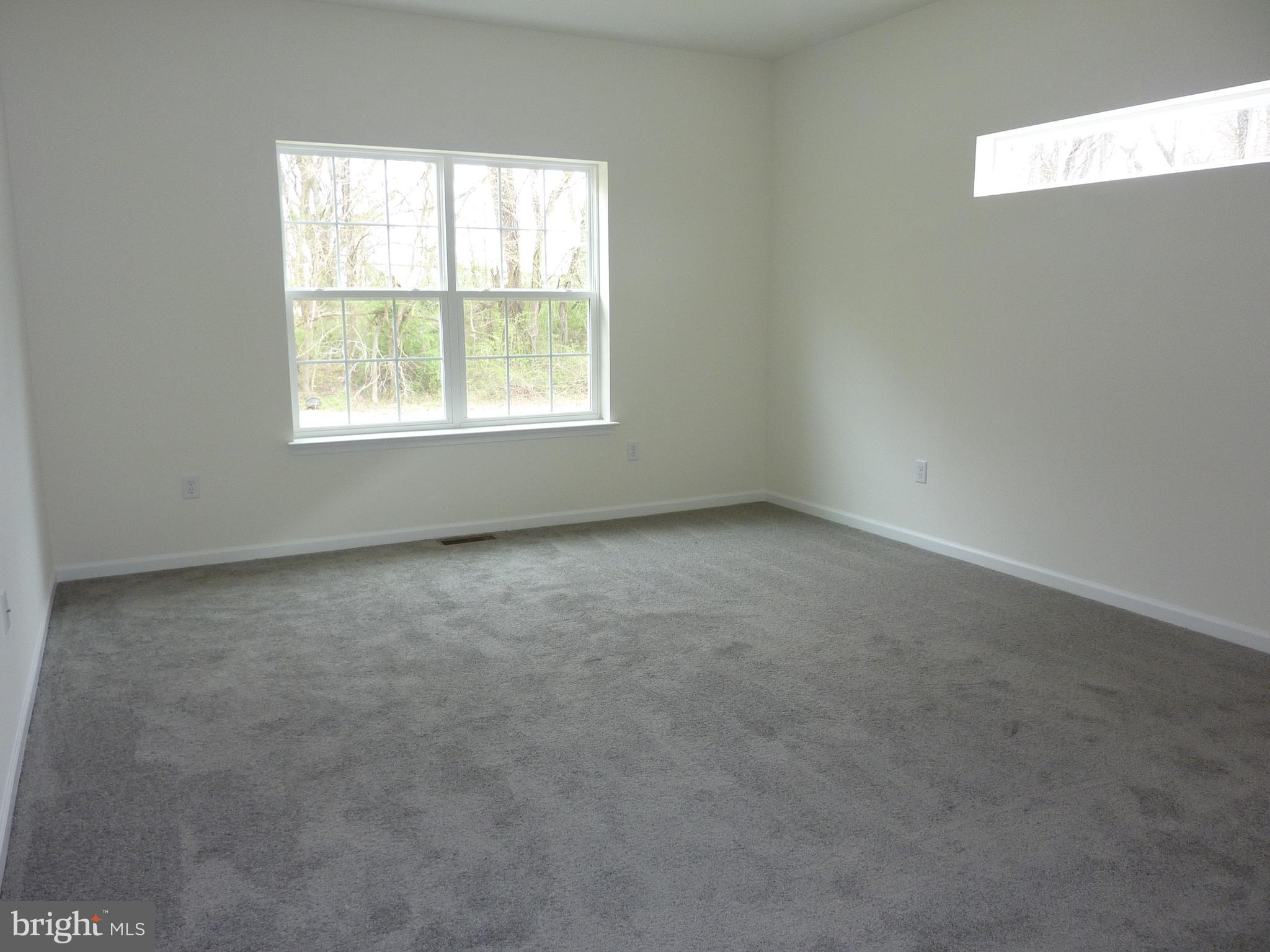 175 Villa Drive Clayton, DE 19938 - Photo 16 of 44 an empty room with a window
