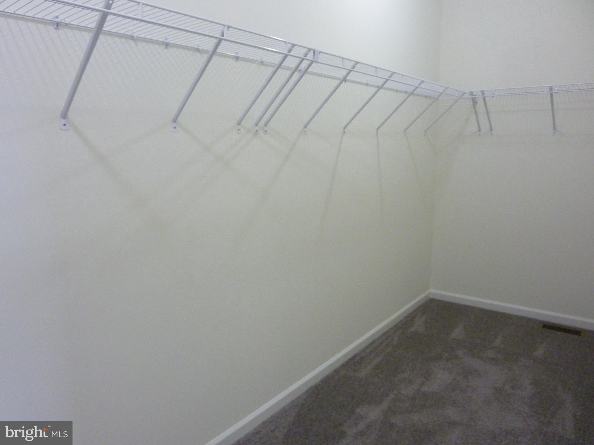 175 Villa Drive Clayton, DE 19938 - Photo 19 of 44 a view of a room with racks on the wall