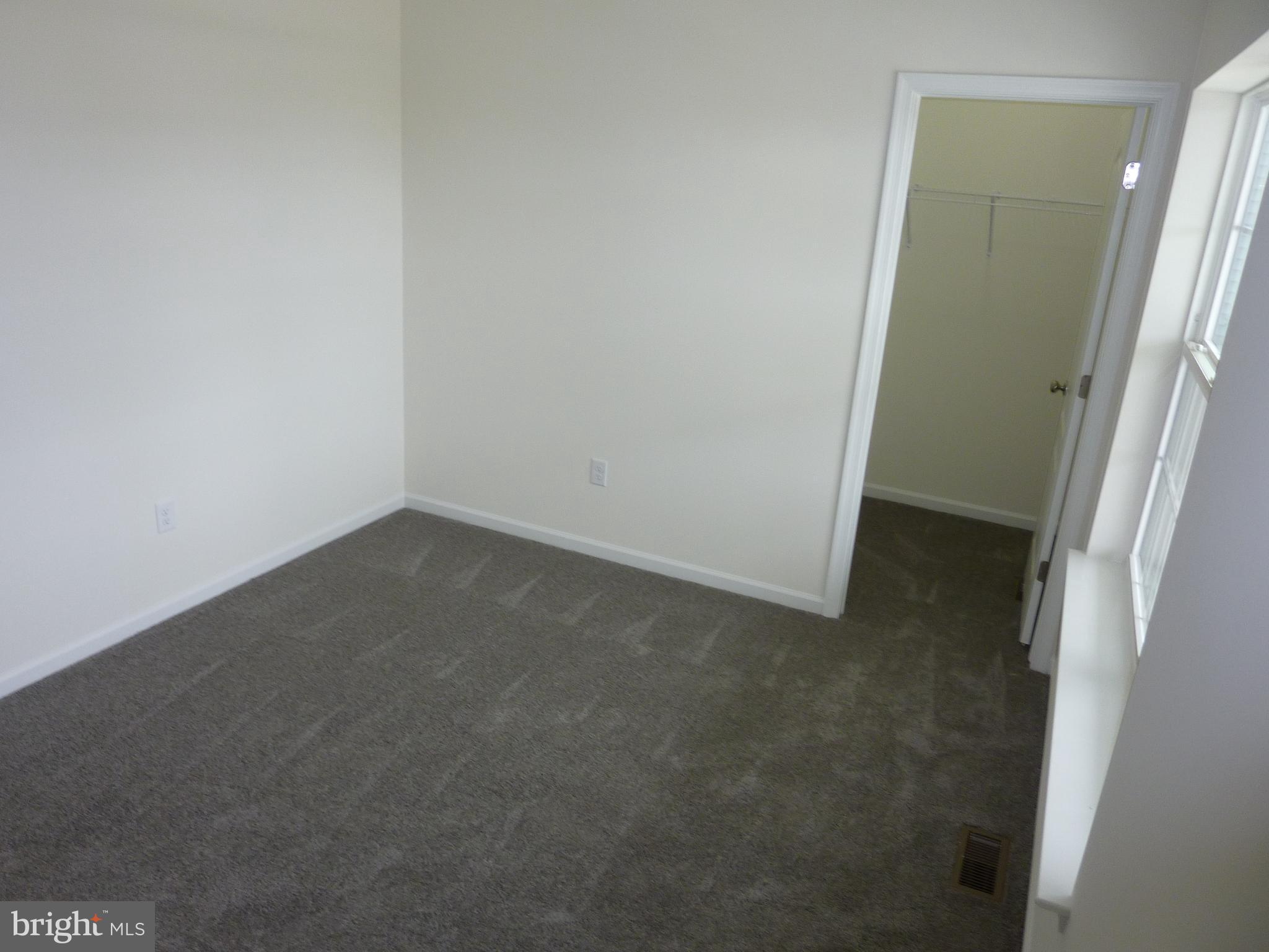 175 Villa Drive Clayton, DE 19938 - Photo 28 of 44 an empty room with a door