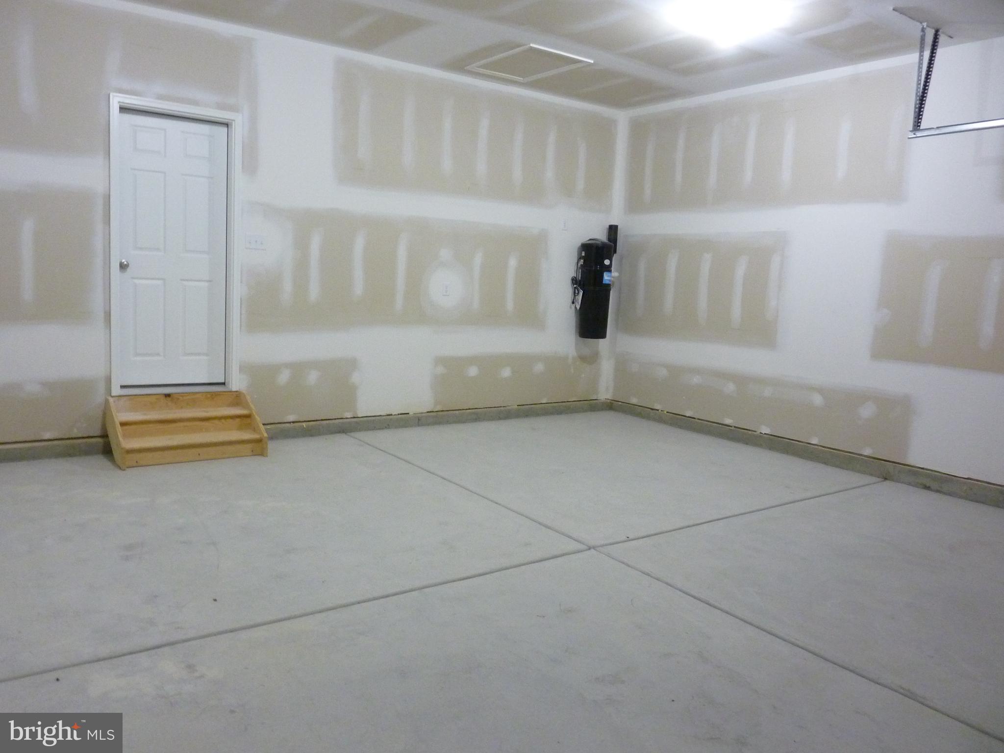 175 Villa Drive Clayton, DE 19938 - Photo 32 of 44 a view of walk in closet with empty racks