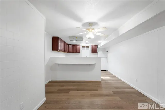 a view of entryway and kitchen