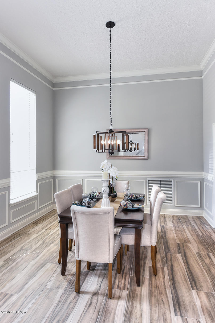 14511 Mandarin Road Jacksonville, FL 32223 - Photo 15 of 91 a view of a dining room with furniture and wooden floor