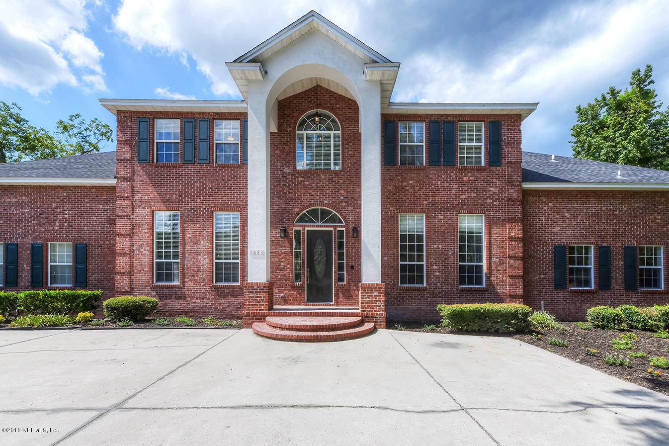 14511 Mandarin Road Jacksonville, FL 32223 - Photo 2 of 91 a front view of a house with garden