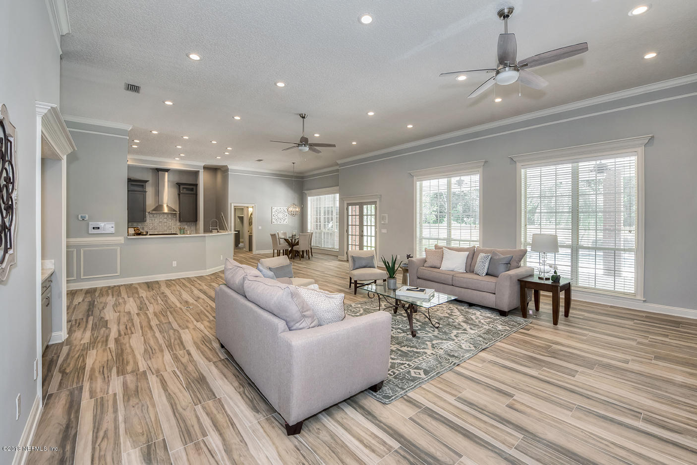 14511 Mandarin Road Jacksonville, FL 32223 - Photo 22 of 91 a living room with furniture and a large window