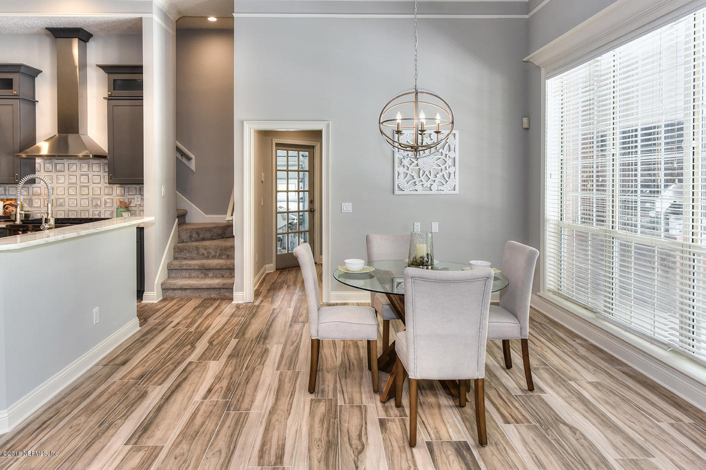 14511 Mandarin Road Jacksonville, FL 32223 - Photo 29 of 91 a view of a dining room with furniture window and wooden floor