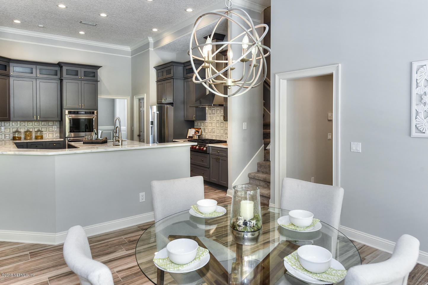 14511 Mandarin Road Jacksonville, FL 32223 - Photo 30 of 91 a kitchen with stainless steel appliances a dining table and chairs in it