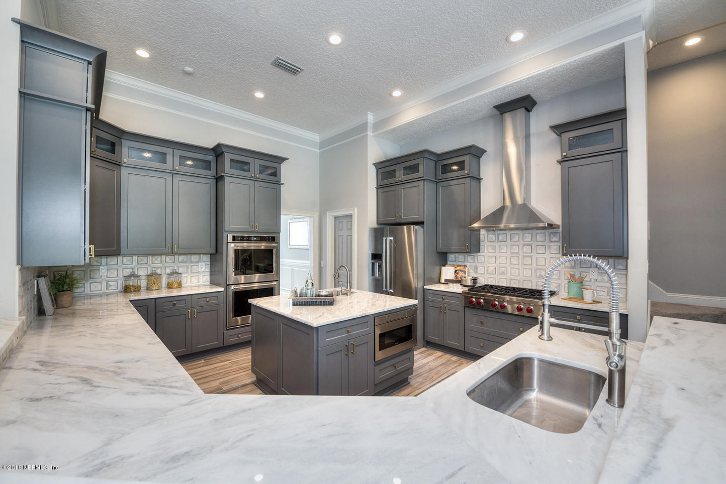 14511 Mandarin Road Jacksonville, FL 32223 - Photo 32 of 91 a kitchen with stainless steel appliances kitchen island granite countertop a sink and a refrigerator