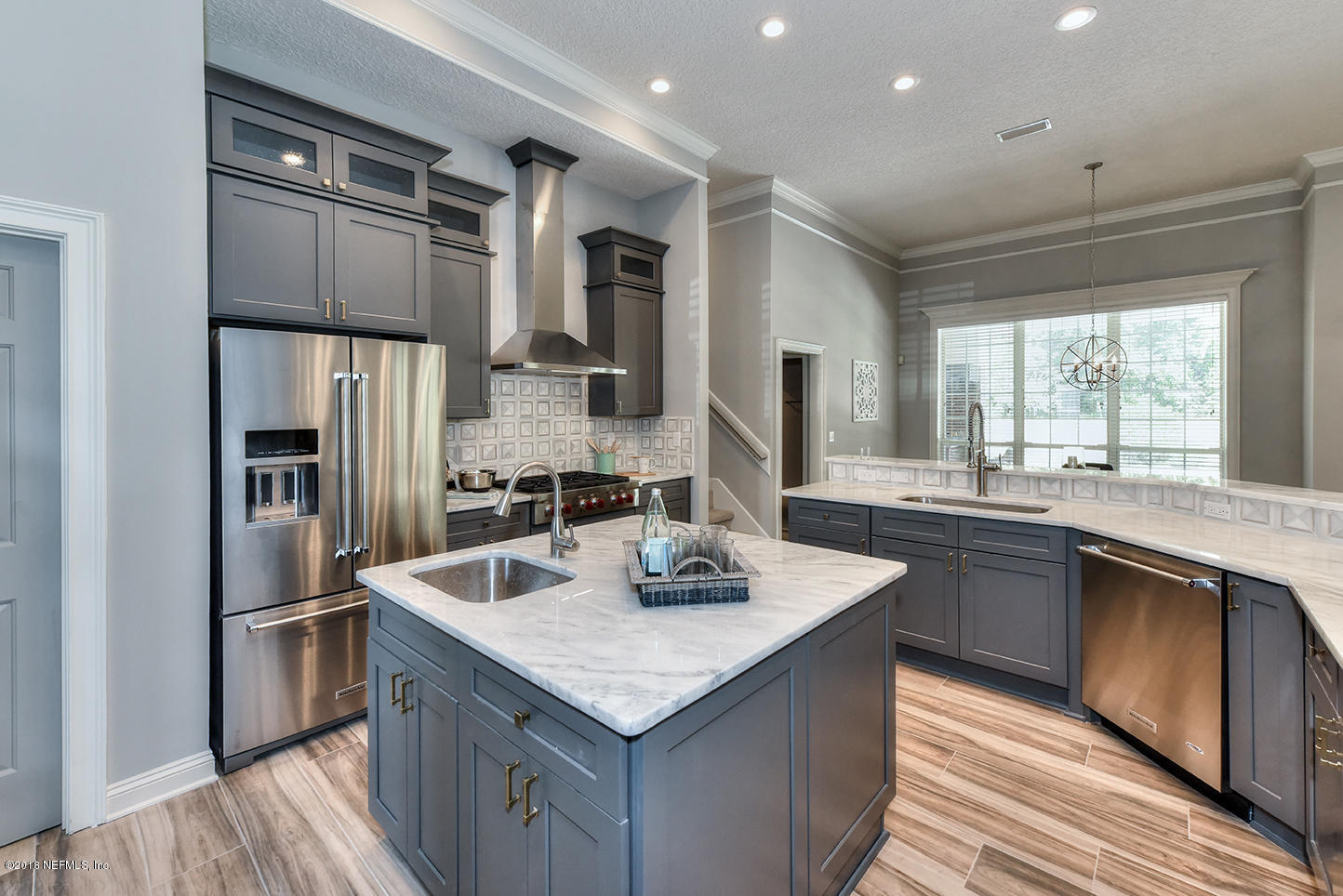 14511 Mandarin Road Jacksonville, FL 32223 - Photo 34 of 91 a kitchen with granite countertop kitchen island stainless steel appliances a sink stove and refrigerator