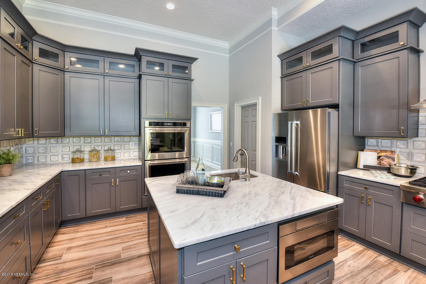 14511 Mandarin Road Jacksonville, FL 32223 - Photo 35 of 91 a kitchen with kitchen island granite countertop a sink stove and refrigerator
