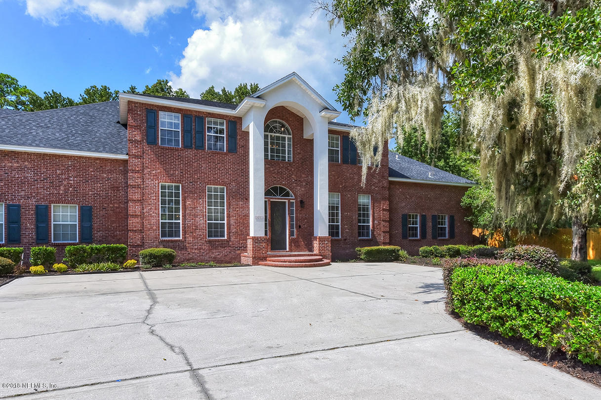 14511 Mandarin Road Jacksonville, FL 32223 - Photo 4 of 91 a front view of a house with a yard