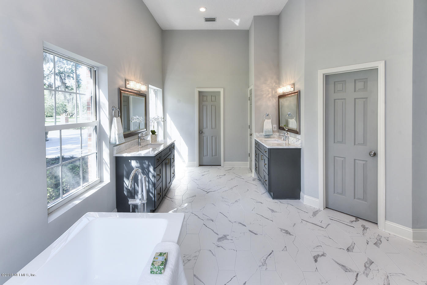 14511 Mandarin Road Jacksonville, FL 32223 - Photo 52 of 91 a spacious bathroom with a granite countertop sink a mirror and a shower
