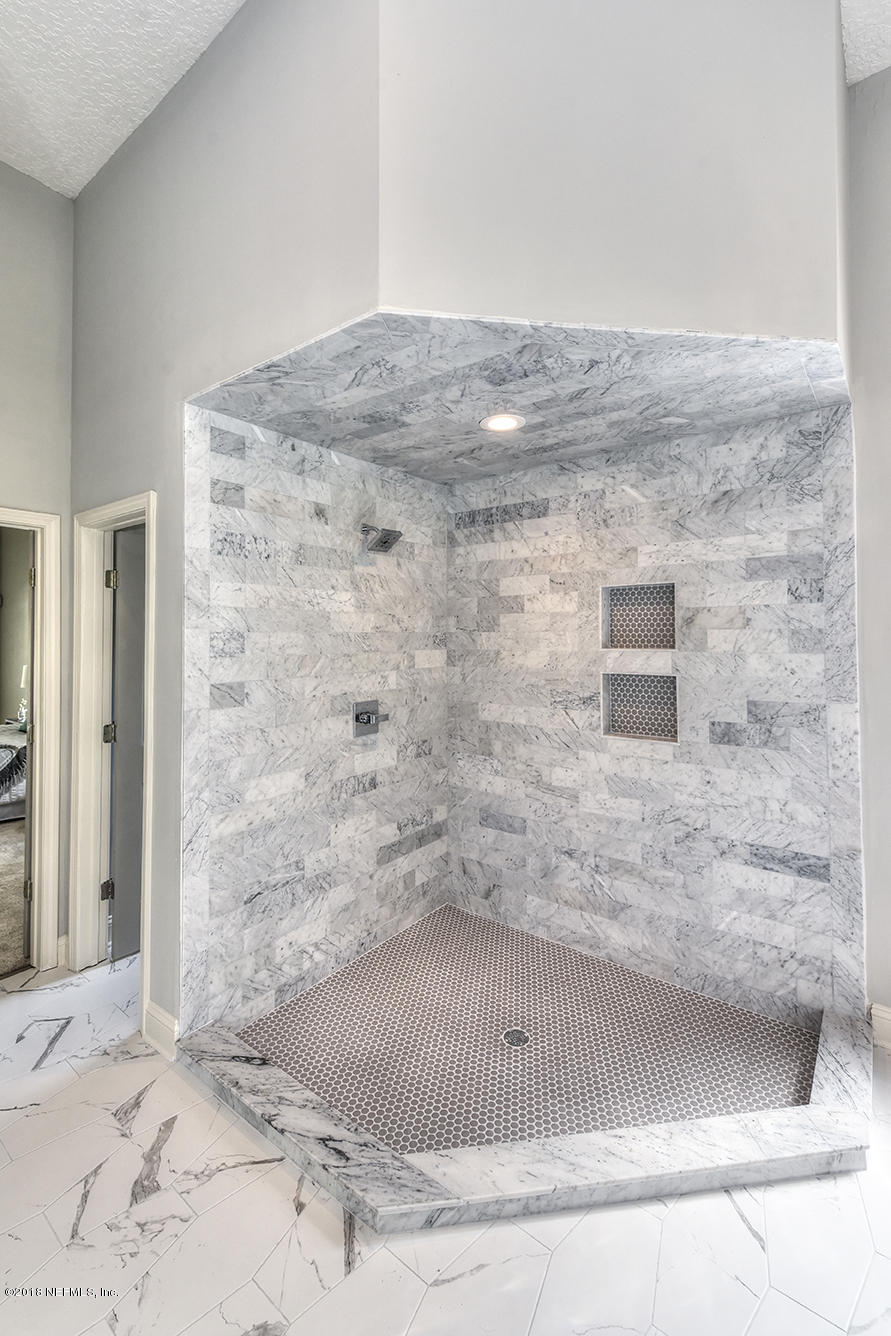 14511 Mandarin Road Jacksonville, FL 32223 - Photo 54 of 91 a bathroom with a shower