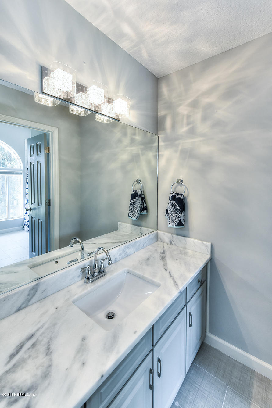 14511 Mandarin Road Jacksonville, FL 32223 - Photo 76 of 91 a bathroom with a sink vanity and a mirror