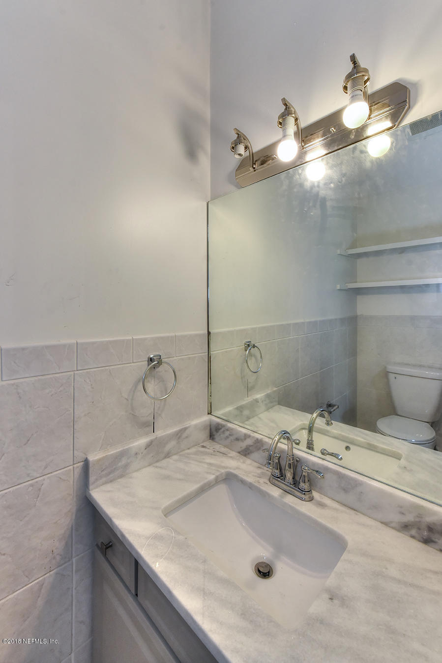 14511 Mandarin Road Jacksonville, FL 32223 - Photo 79 of 91 a bathroom with a sink and a mirror