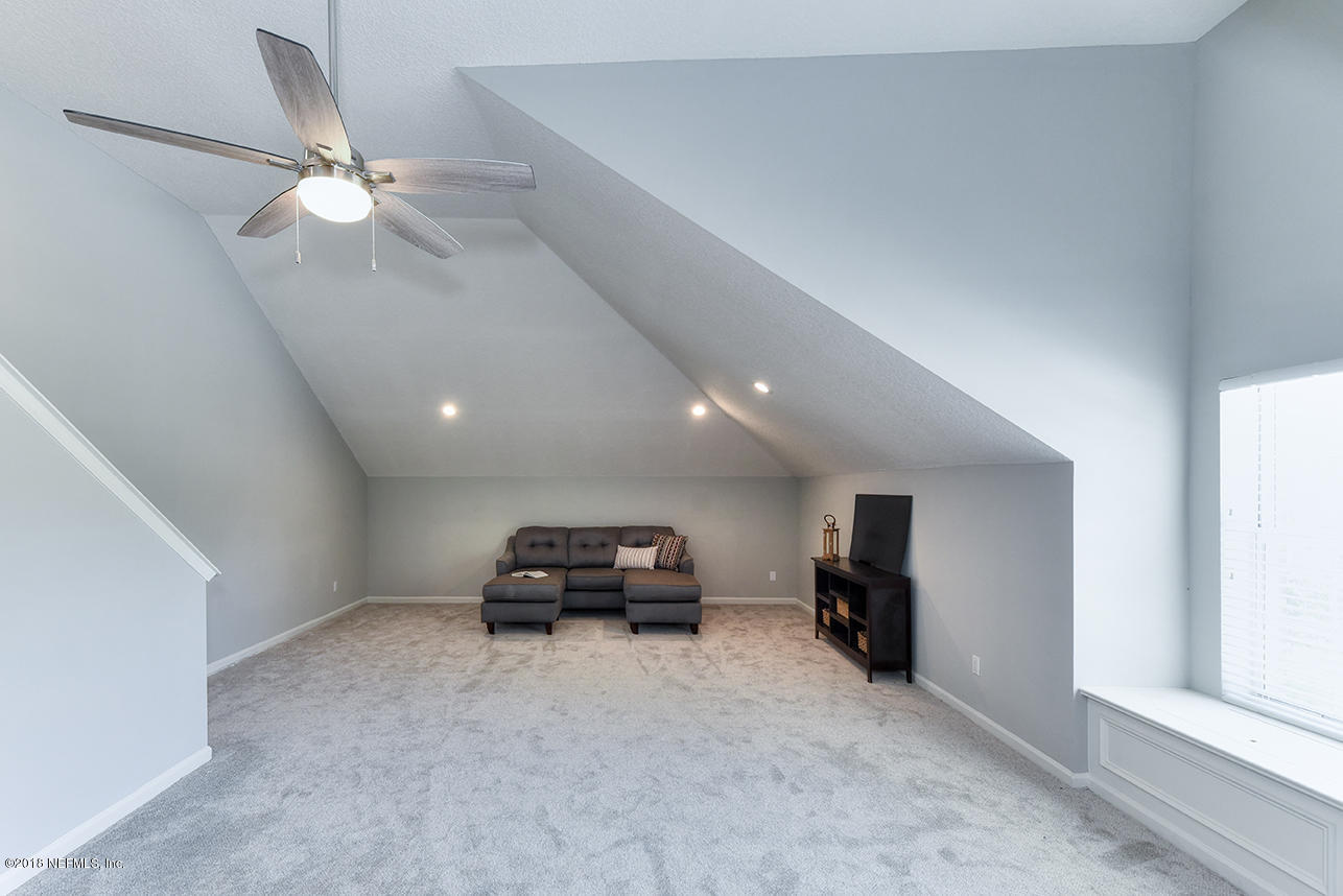 14511 Mandarin Road Jacksonville, FL 32223 - Photo 80 of 91 a living room with furniture and a ceiling fan