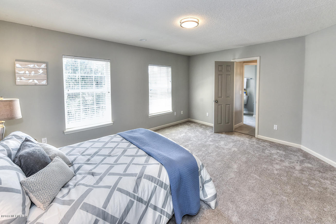 14511 Mandarin Road Jacksonville, FL 32223 - Photo 82 of 91 a bedroom with a bed and a window