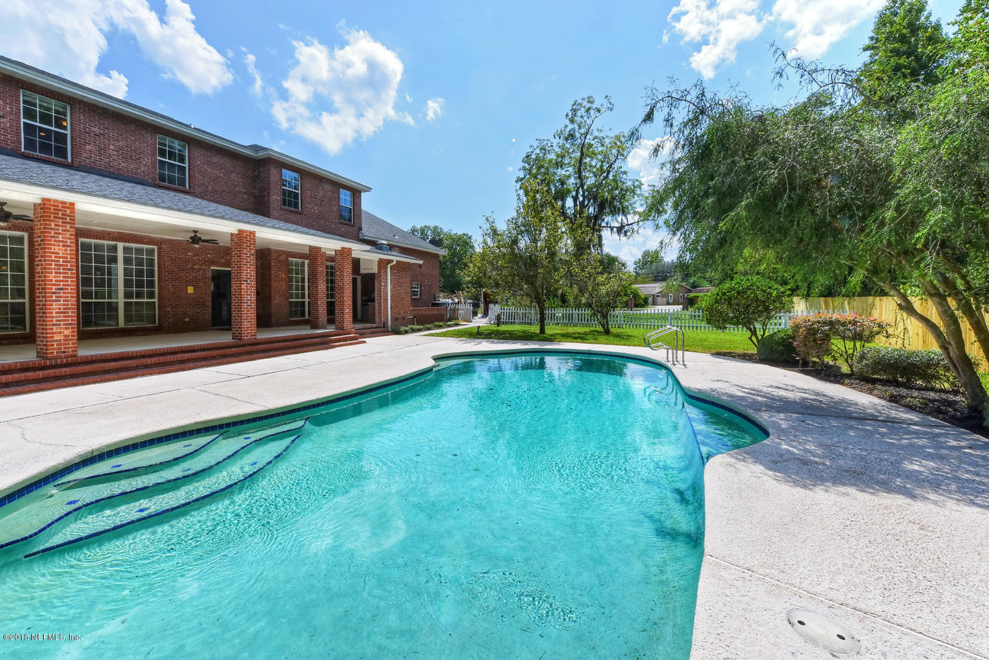 14511 Mandarin Road Jacksonville, FL 32223 - Photo 90 of 91 a view of a house with swimming pool and porch with furniture