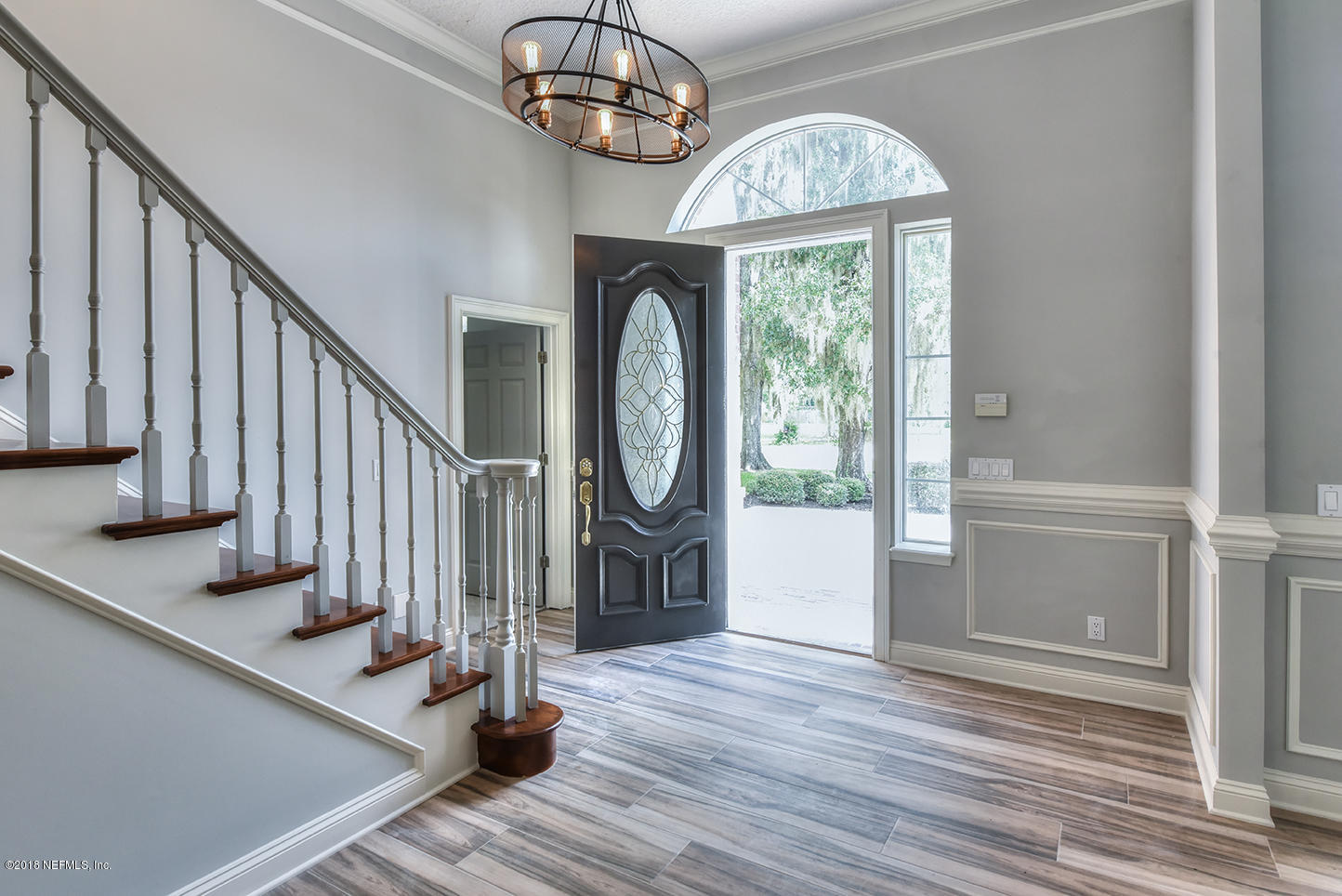14511 Mandarin Road Jacksonville, FL 32223 - Photo 9 of 91 a view of an entryway with wooden floor and door