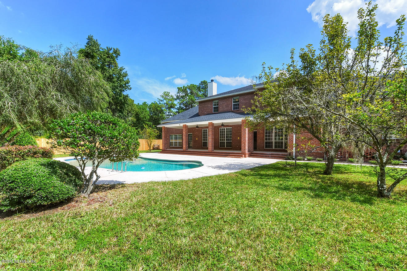 14511 Mandarin Road Jacksonville, FL 32223 - Photo 91 of 91 a front view of a house with a yard