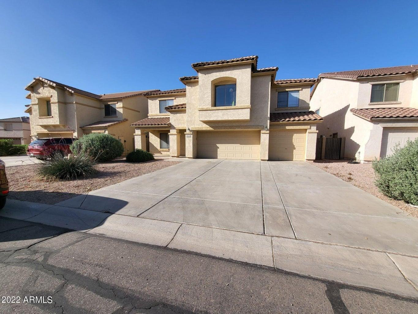 43589 West Cowpath Road Maricopa, AZ 85138 - Photo 2 of 6 a view of a house with a yard
