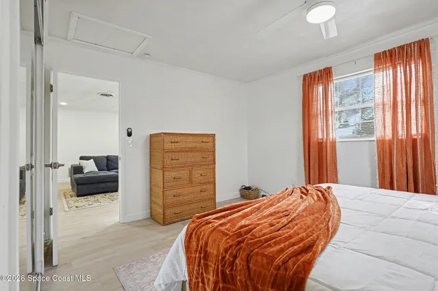 a bedroom with a bed and dresser