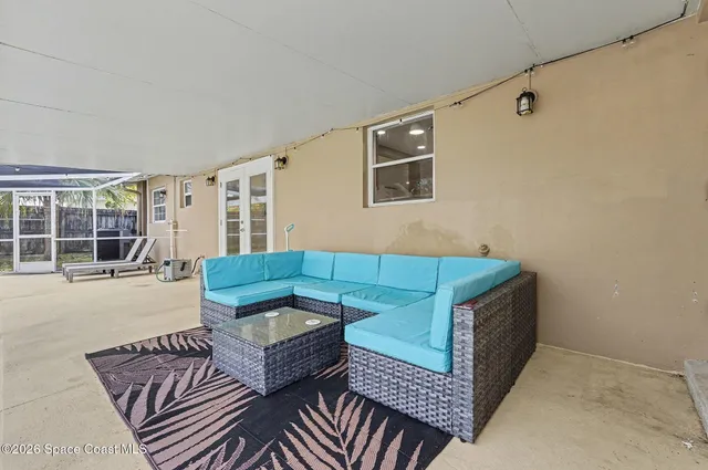 a living room with furniture and a window