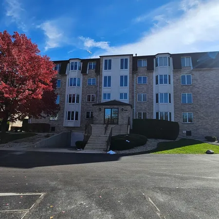 a view of a building with a yard