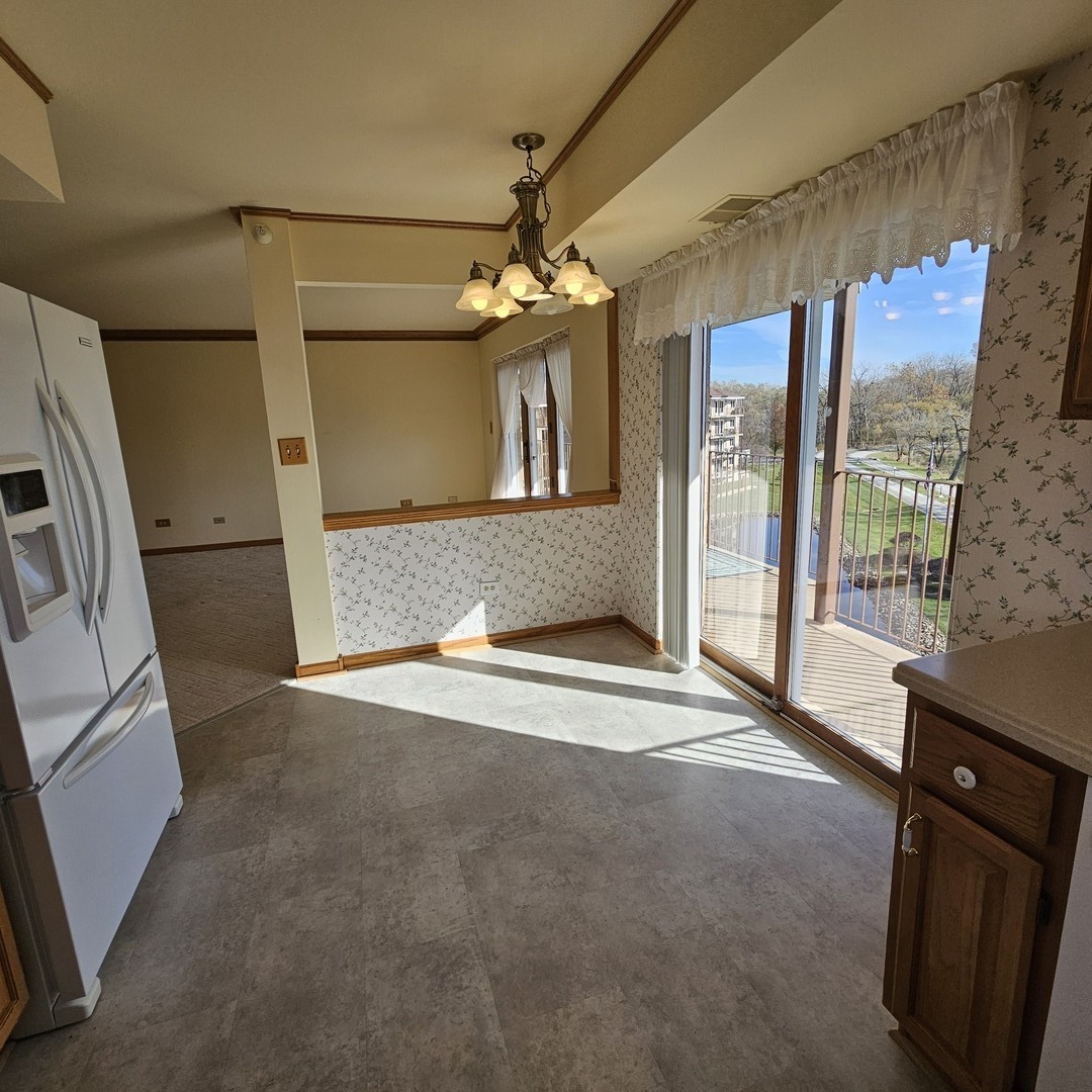 3620 186th Street, Unit 405 Lansing, IL 60438 - Photo 15 of 36 a view of an empty room with a fireplace