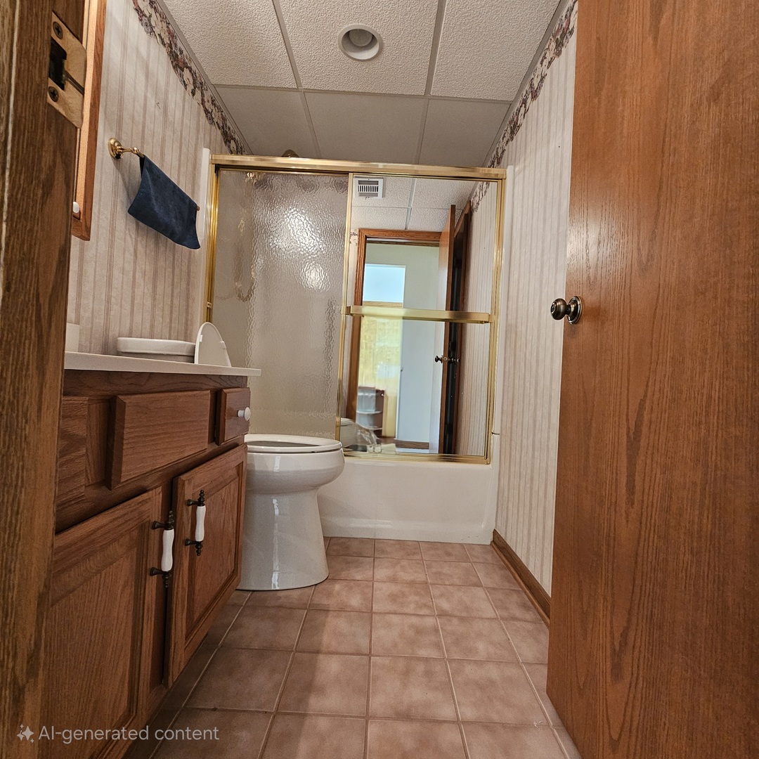 3620 186th Street, Unit 405 Lansing, IL 60438 - Photo 21 of 36 a bathroom with a sink a toilet and shower