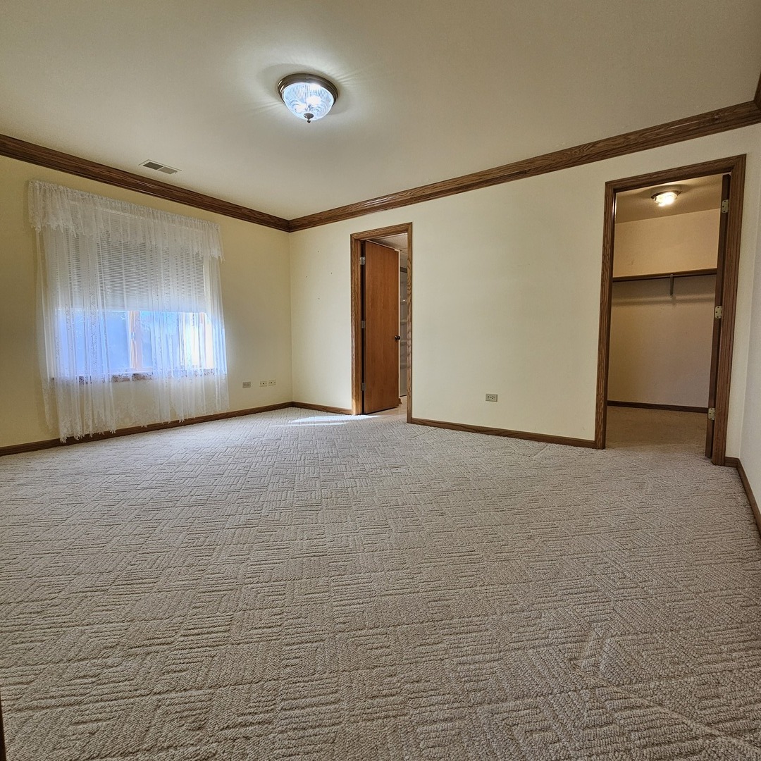 3620 186th Street, Unit 405 Lansing, IL 60438 - Photo 27 of 36 a view of an empty room with a window