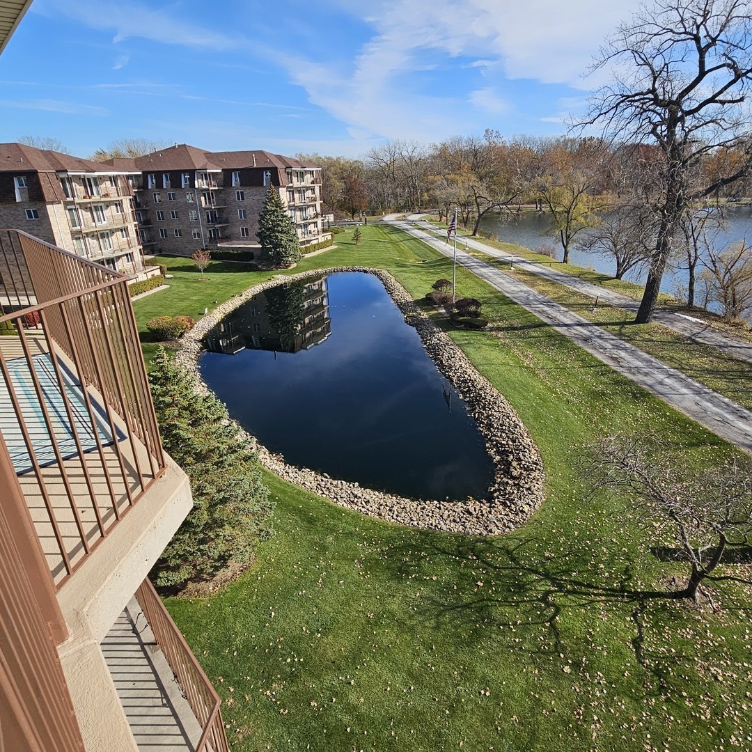 3620 186th Street, Unit 405 Lansing, IL 60438 - Photo 34 of 36 a view of a swimming pool with a yard