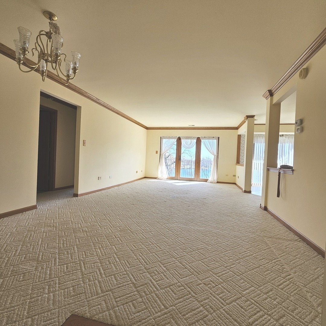 3620 186th Street, Unit 405 Lansing, IL 60438 - Photo 6 of 36 a view of big room with windows