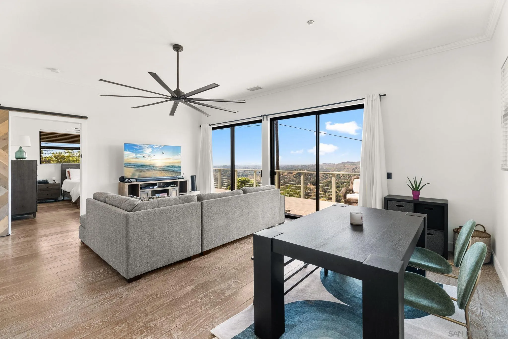 5521 Rainbow Heights Road Fallbrook, CA 92028 - Photo 17 of 36 a living room with furniture a table and a large window