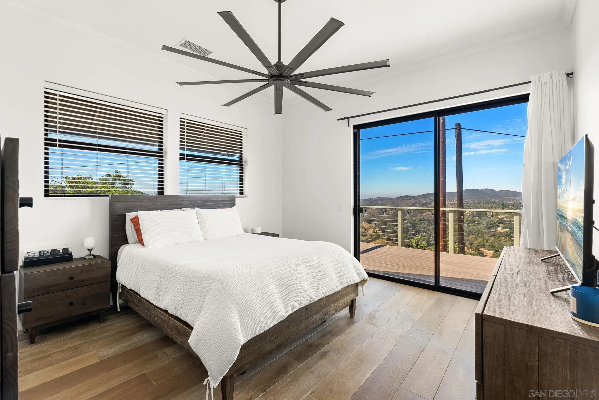 5521 Rainbow Heights Road Fallbrook, CA 92028 - Photo 20 of 36 a bedroom with a large bed and a tv